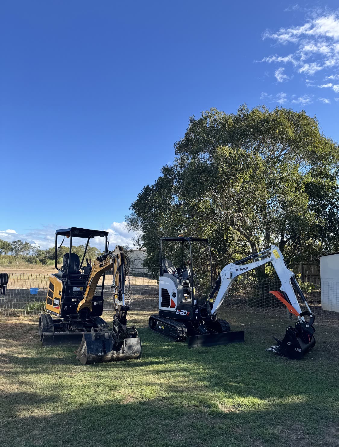 SANY SY18U and Bobcat E20z mini excavators parked side by side